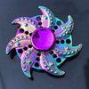 A vibrant iridescent rainbow metal fidget spinner with a smooth, silent rotation.