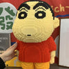 A detailed mini building blocks model kit of a character with black markings and an orange shirt.