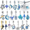 Sterling silver ocean life charm pendant set featuring starfish, sea turtle, and whale shark charms.