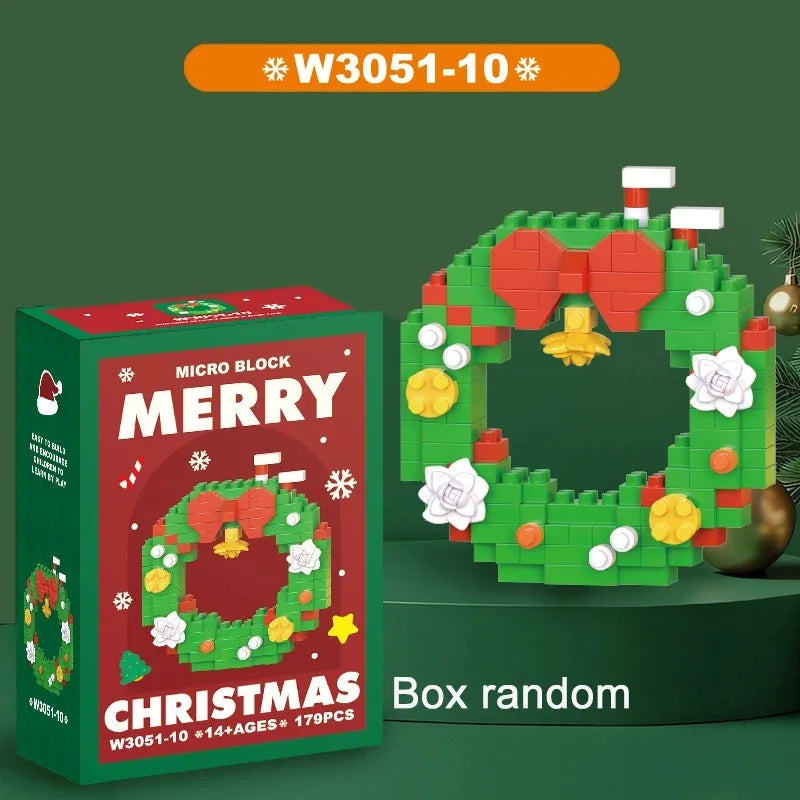 A box of Merry Christmas micro block set featuring a green wreath decorated with red bows and white flowers.