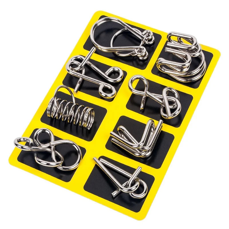 A yellow plastic tray holding eight different types of metal brain teaser puzzle clips.