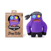 A purple plush toy of a funny ugly monster with human-like teeth, packaged in a brown box.