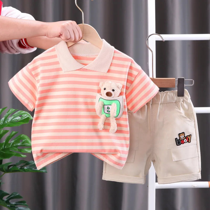 A pink and white striped kids summer outfit set featuring a short-sleeved shirt and matching shorts.