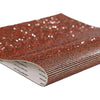 A close-up view of sparkling red rhinestone adhesive tape for DIY crafts and decor.