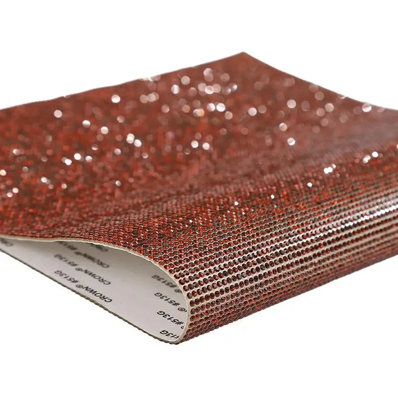 A close-up view of sparkling red rhinestone adhesive tape for DIY crafts and decor.