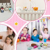 Assorted mini animal plush toys with keychain loops displayed on a table and hanging rack.