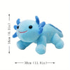 A light blue axolotl plush toy with large eyes and fins, shown next to a measurement scale.