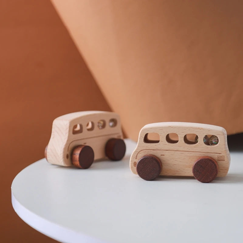 A wooden Montessori push cart toy set featuring a handcrafted beech car and bus with wooden wheels.