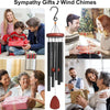 A set of decorative wind chimes featuring a 28 inch Mediterranean fairy design hanging from a black cord.