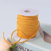 A roll of orange velvet faux suede braided ribbon for crafting and gift wrapping