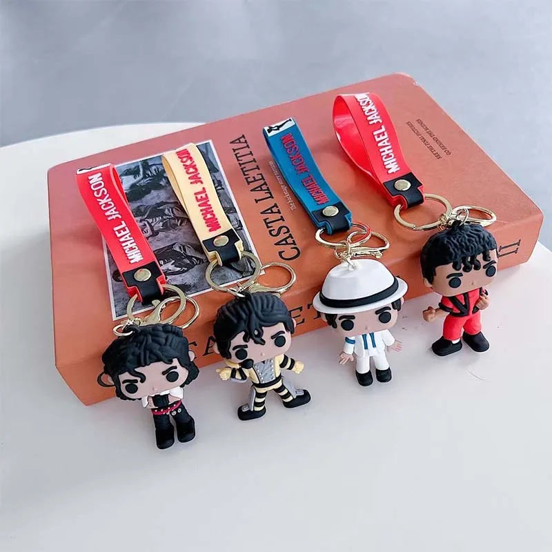 Michael Jackson music icon keychain featuring a figure and a metal buckle on a pink box.