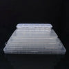 A stack of clear plastic storage boxes with dividers for jewelry and craft supplies