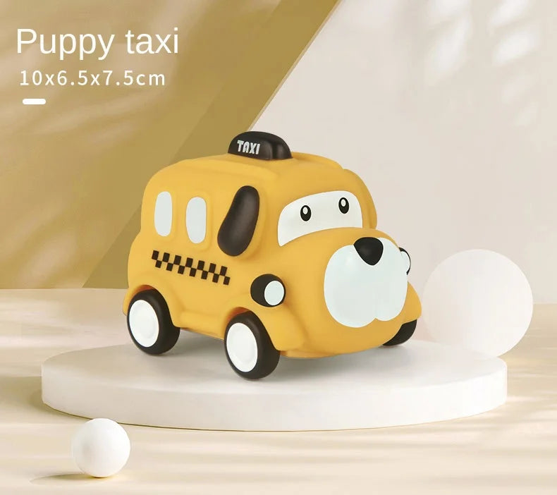 A yellow taxi toy car with black details is displayed on a white circular base.