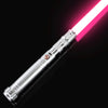 A silver lightsaber with a bright pink blade is shown diagonally against a black background.