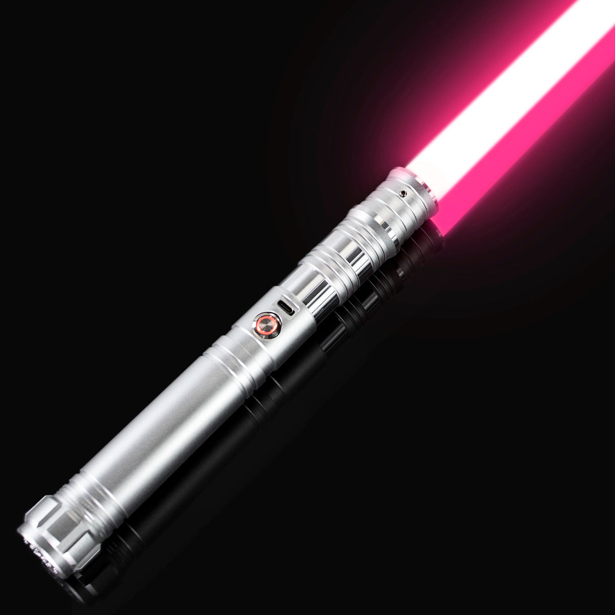 A silver lightsaber with a bright pink blade is shown diagonally against a black background.