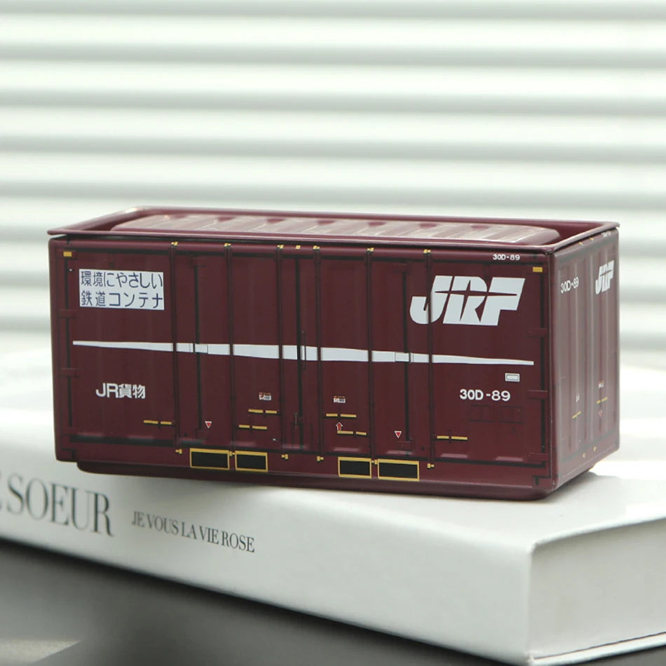 A rectangular, reddish-brown industrial storage box labeled JRF with a white lid, resting on a white surface.