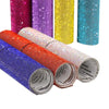 A collection of colorful sparkling rhinestone adhesive tape rolls in various shades including purple, yellow, pink, and blue.