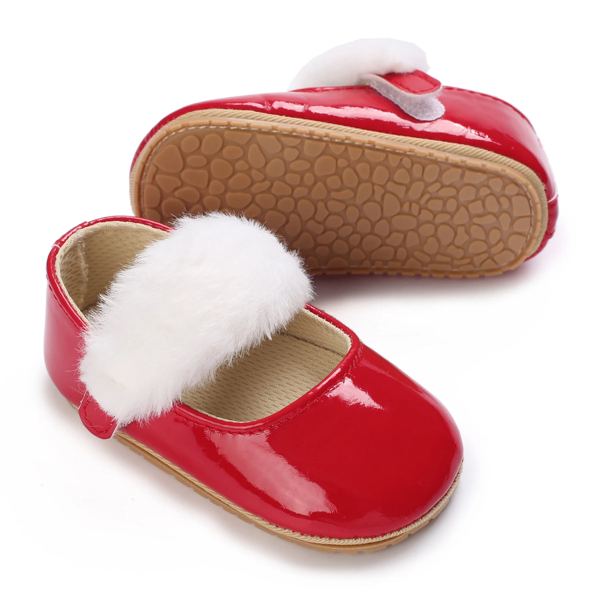 A bright red lace-trimmed moccasin shoe for a baby girl with white faux fur trim.