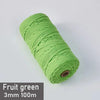 A spool of bright green 3mm cotton macrame cord measuring 100 meters for DIY crafts.