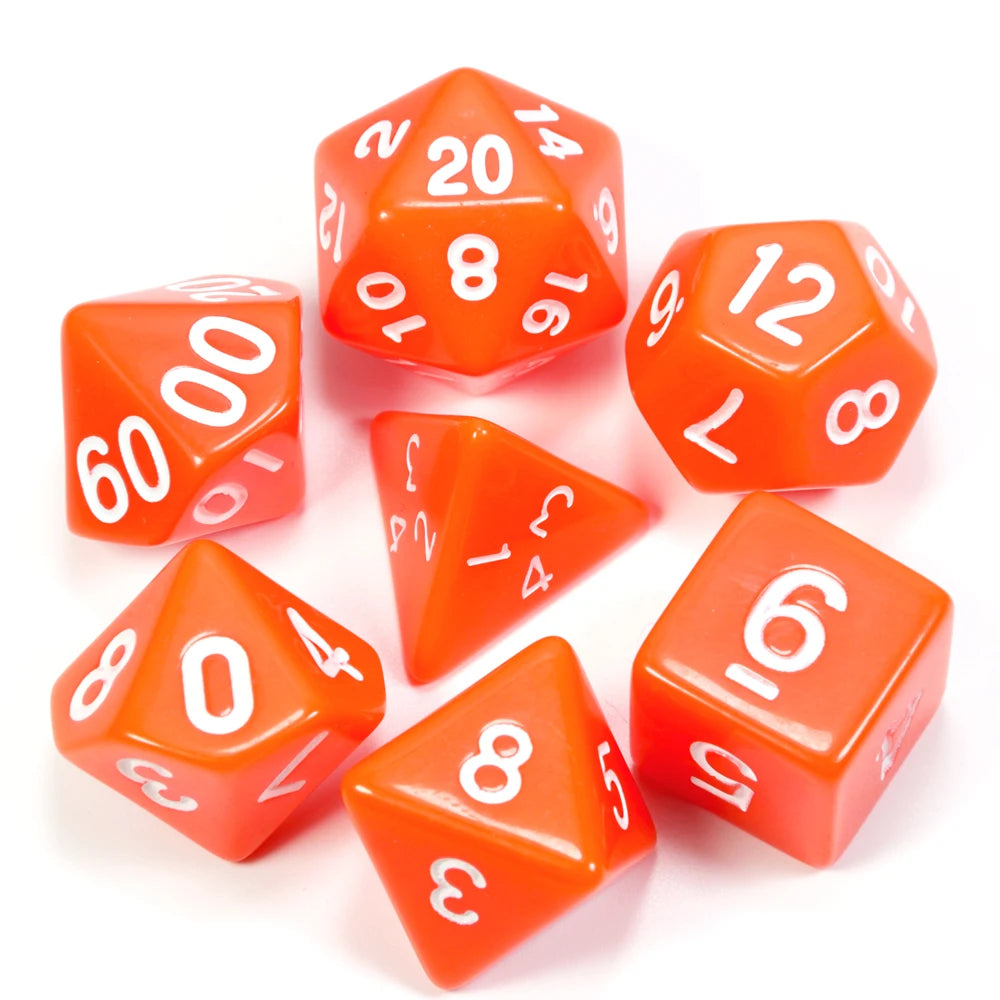 A collection of orange acrylic dice showing various numbers and shapes on a white background.