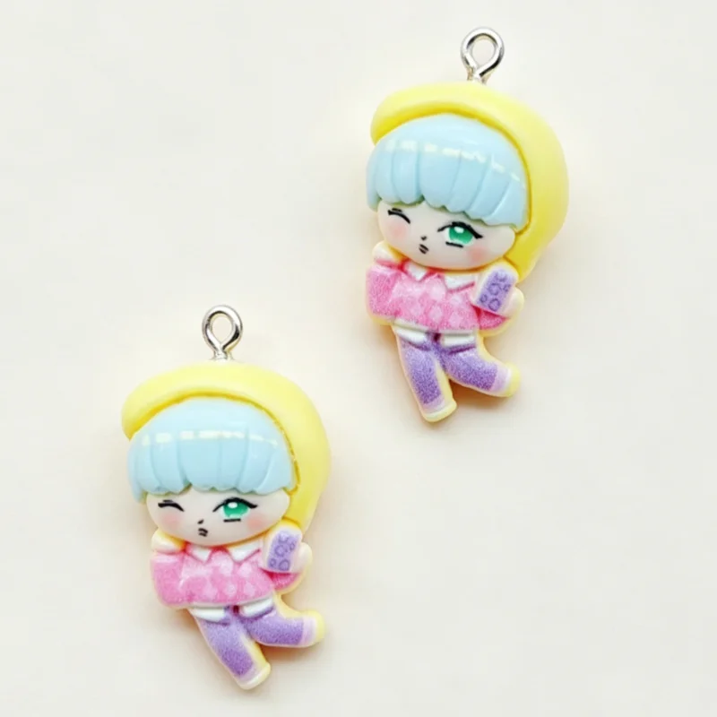 A set of 11 cartoon resin pendant charms featuring a blonde character with light blue hair and pink clothing.
