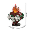 A red heart shaped building block set featuring a golden crown and white roses.