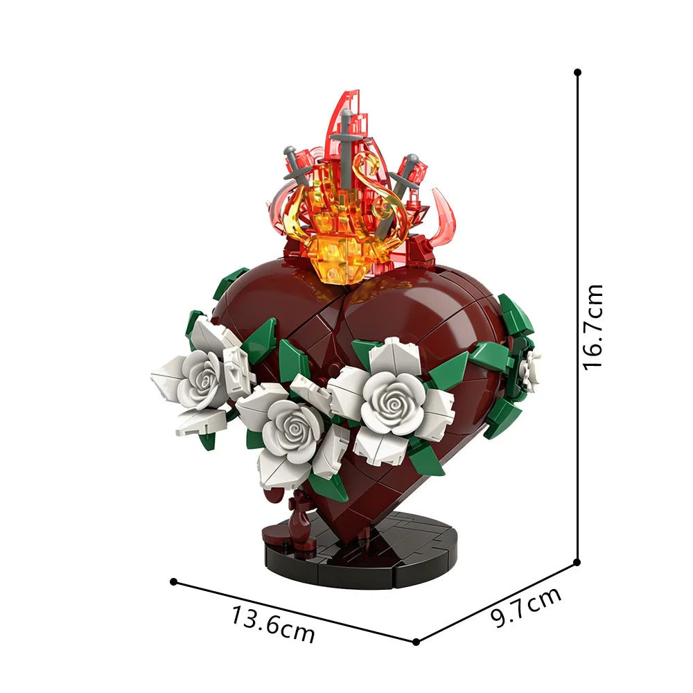 A red heart shaped building block set featuring a golden crown and white roses.