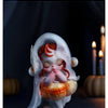 A delicate, translucent white plush doll pendant with reddish-orange hair is shown against a dark background.