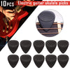 A set of ten black non-slip nylon electric guitar ukulele picks are shown for practice.
