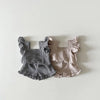 A set of baby girl ruffle top and shorts in black and beige gingham fabric.