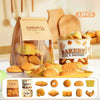 A set of realistic pretend play food items including bread rolls pastries and baked goods displayed in a clear container.
