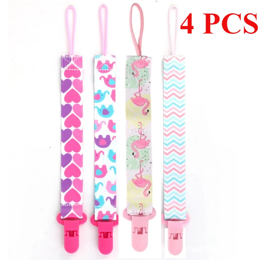 Set of four soft pacifier clips with double-sided prints featuring various colorful patterns for babies
