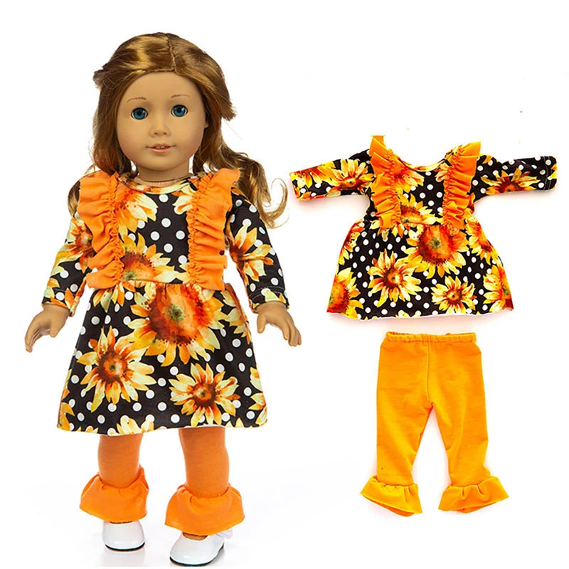 A doll outfit set featuring a black blouse, sunflower print skirt, and orange tights.