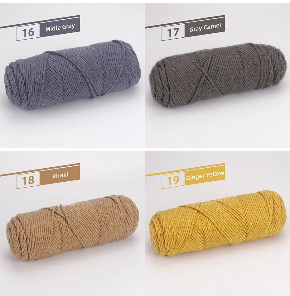 Three skeins of soft cotton blend yarn in shades of gray, camel, khaki, and ginger yellow for knitting and crochet.