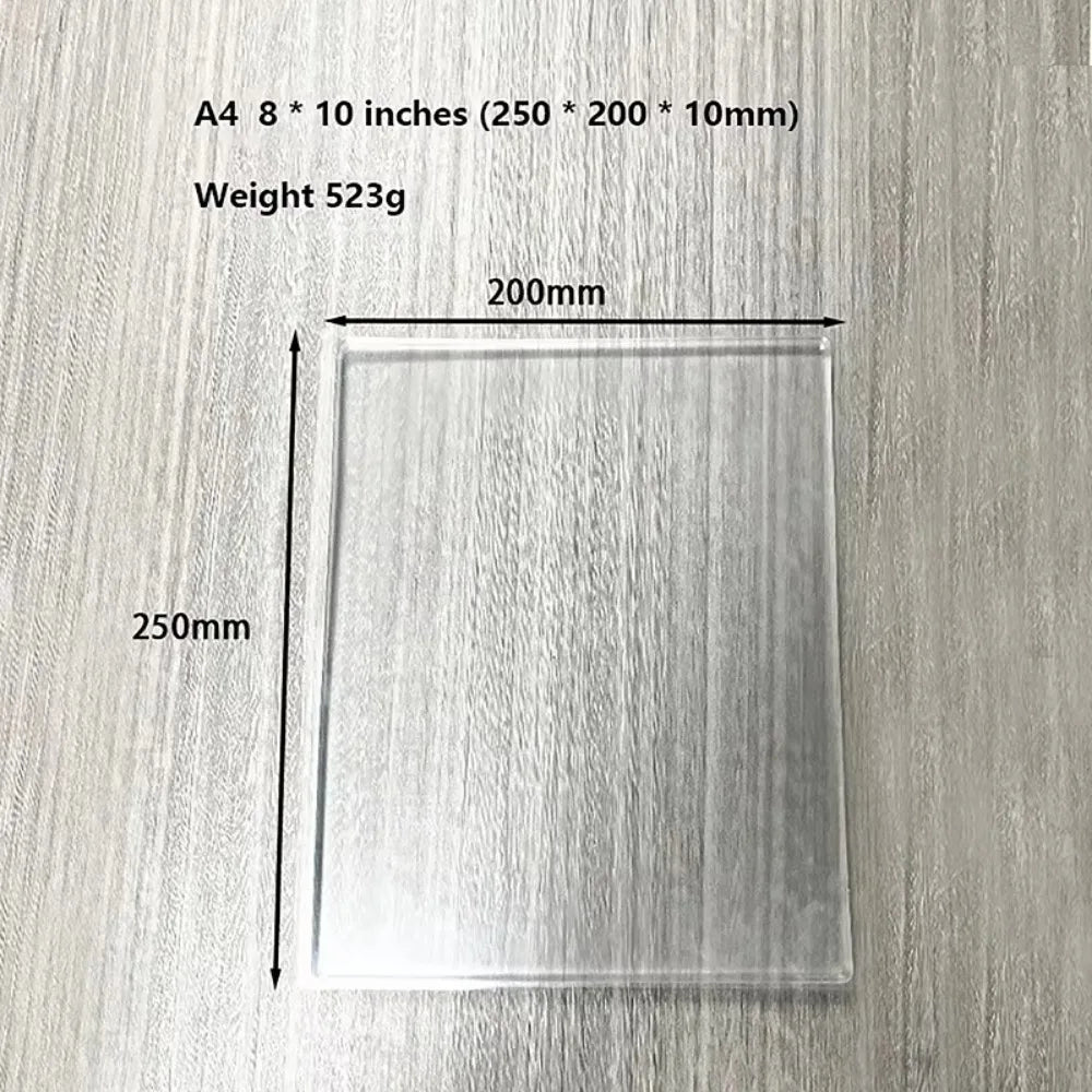 A clear silicone gel printing plate measuring 250mm by 200mm resting on a wooden surface.