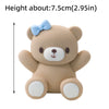 A light brown 3D bear cake topper with a blue bow, designed for birthday or baby shower decorations.