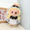 A fluffy yellow rabbit doll dressed in a black and white frilly dress with a lace veil and princess shoes.