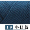 A close-up texture of dark blue premium milk cotton yarn used for knitting.