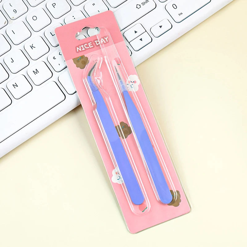 A pink case holds a pair of blue precision stainless steel tweezers for nail art and makeup.