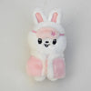 A white and pink cartoon rabbit plush keychain with long ears and a small pink flower detail.