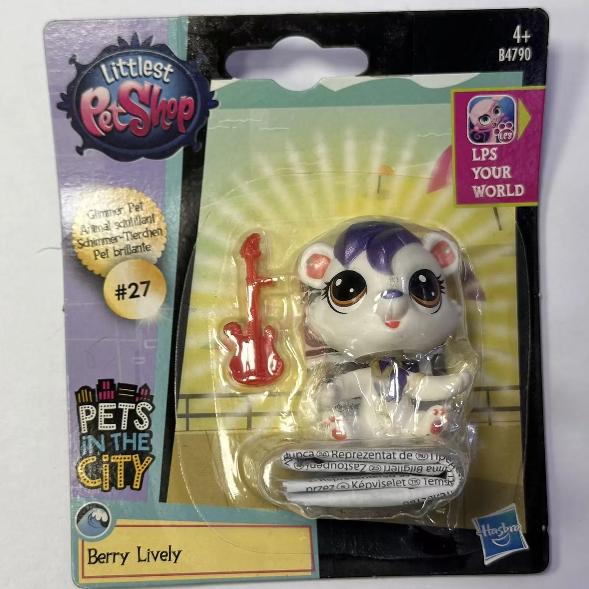 A package of Little Pet Shop figures featuring a purple and white animal character named Berry Lively.