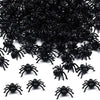 A pile of realistic fake black spiders for Halloween decor and pranks.
