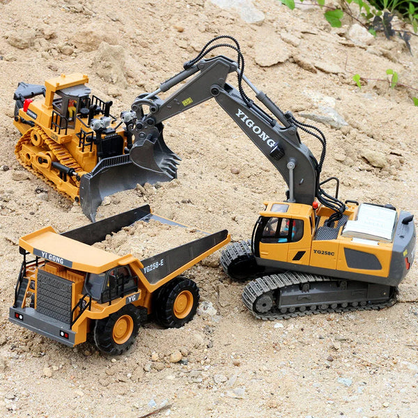 A yellow YIGONG heavy-duty RC excavator bulldozer model with a hydraulic arm and tracks on a dirt surface.