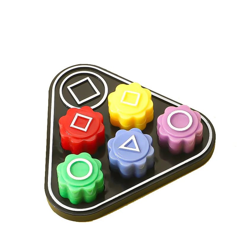 A set of five colored gonggi stones for a traditional Korean game, featuring red, yellow, purple, blue, and green pebbles.