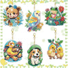 A collection of six diamond painting keychains featuring various animals like a bear, bird, frog, and dog.