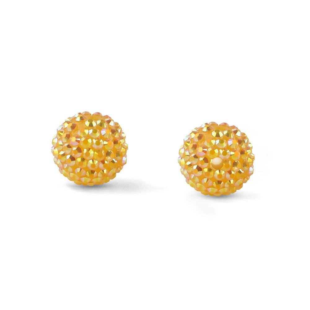Two spherical balls of yellow and gold rhinestones used for jewelry making