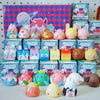 A collection of geometric monster mini bean blind boxes featuring various pink, yellow, and brown vinyl figures.