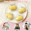 Yellow food-shaped squishy toys packaged in clear plastic on a white plate for stress relief