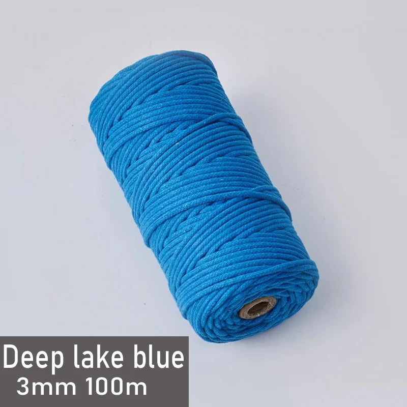 A spool of deep lake blue 3mm cotton macrame cord measuring 100 meters.