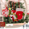 A red felt ornament shaped like a Christmas tree with a yellow star hanging from a white branch.